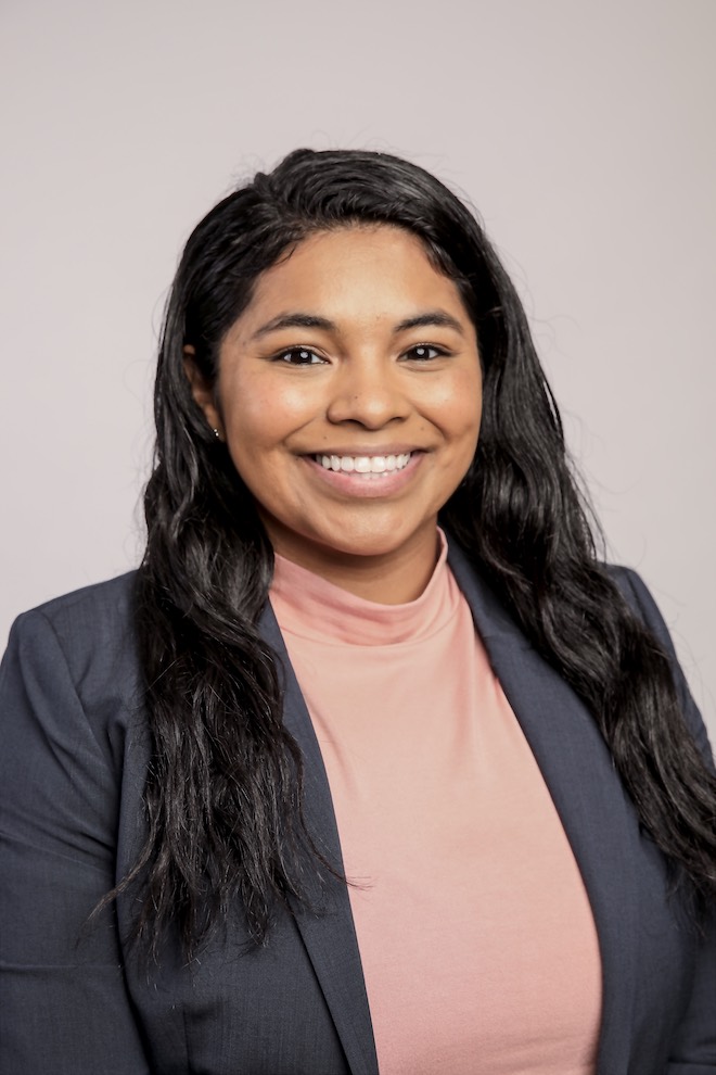 professional photo of healthcare professional with dark hair, smiling