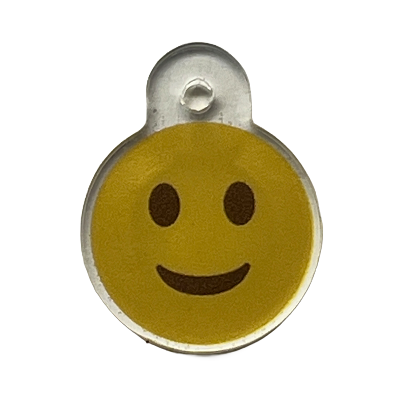 Acrylic charm with a yellow smiley face icon.