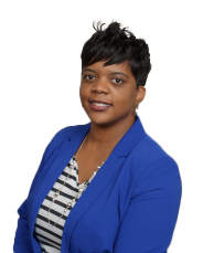 Andrea Bradley-Ewing, MPA, MA. Andrea has short black hair and is wearing a blue blazer.