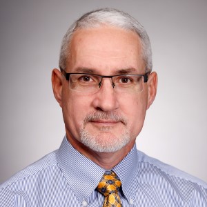 J. Steven Leeder, PharmD, PhD. He has white hair and is wearing glasses.