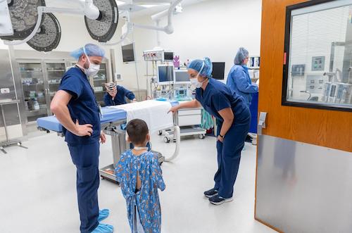 image of team members showing patient what the operating room looks like