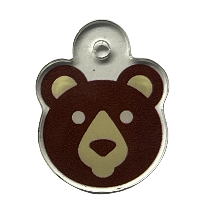 Acrylic charm with a brown teddy bear face icon.
