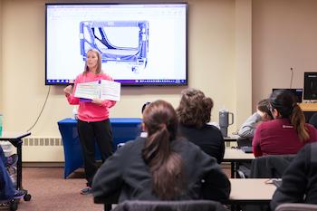 image of team member presenting at clinical orientation