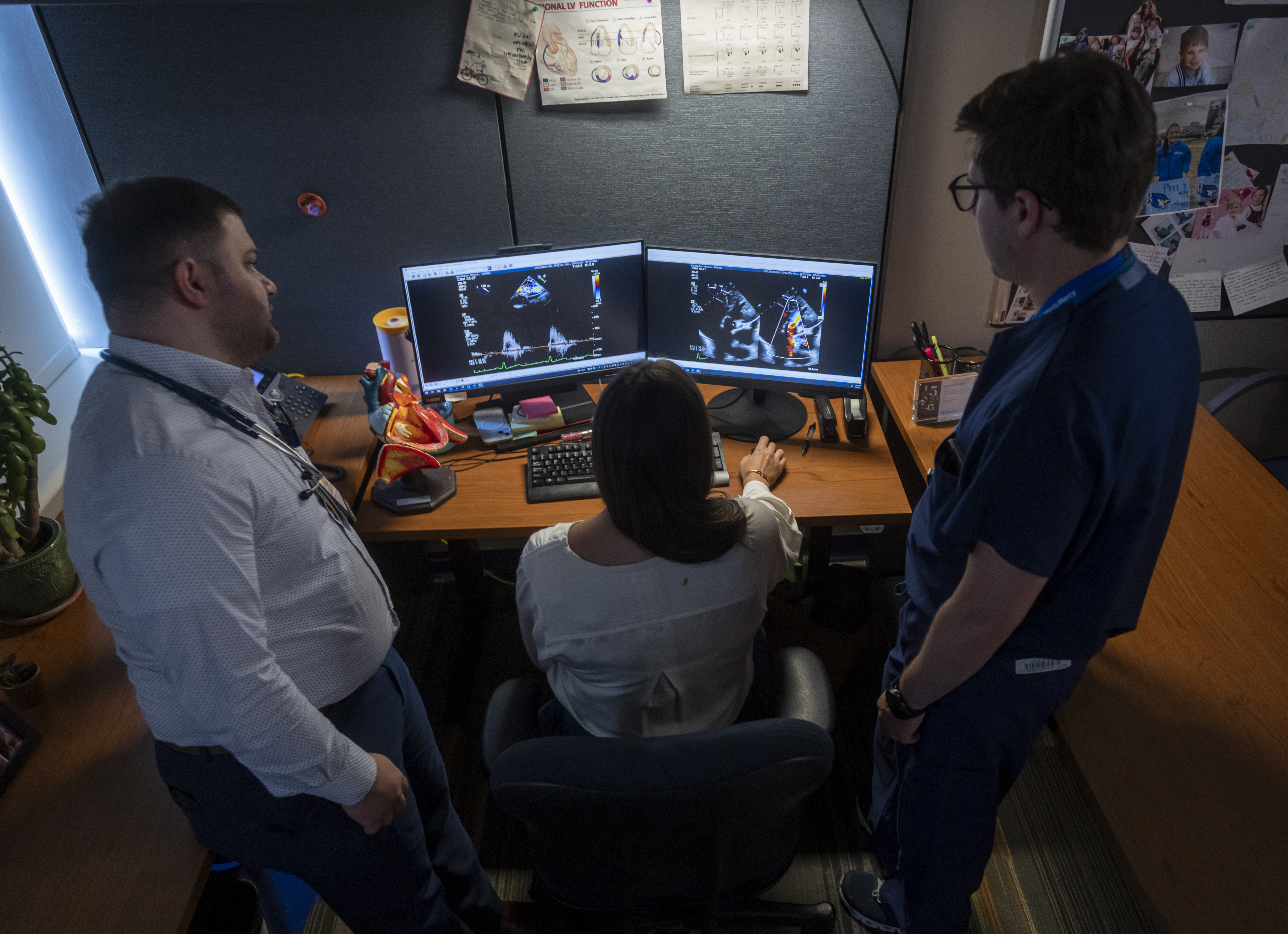 three Fellows at Children's Mercy reviewing medical imaging on a computer screen
