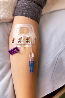photo of a patient's arm with an IV