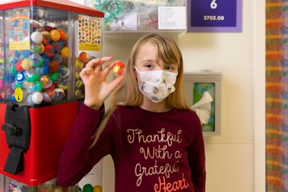 photo of patient selecting a prize after completing infusion