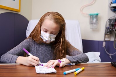 photo of a patient doing a craft in a patient room