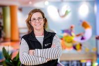 photo of a nurse smiling in the lobby of Children's Mercy