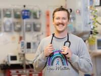 photo of a nurse smiling in a patient room 