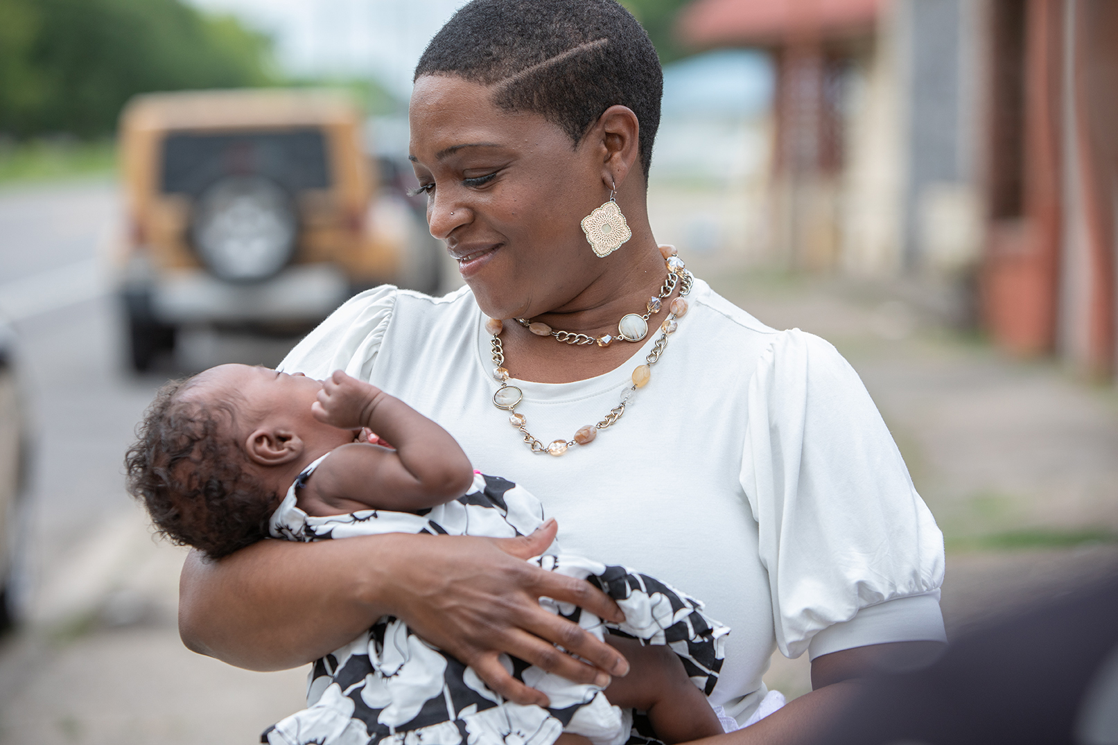 Woman holding baby.