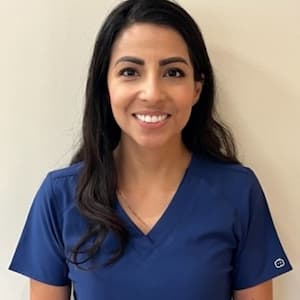 Gaby Caballero in the blue scrubs 