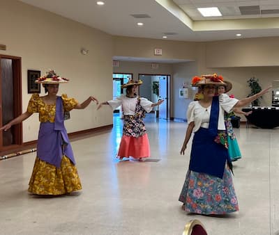 team members participating in cultural night, dancing