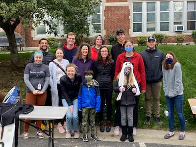photo of residents participating in local event providing coats to the community