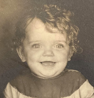 Black-and-white childhood portrait of a young Children's Mercy patient