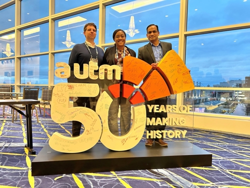 Office of Technology Transfer and Commercialization team pose with an AUTM 2025 annual meeting sign.