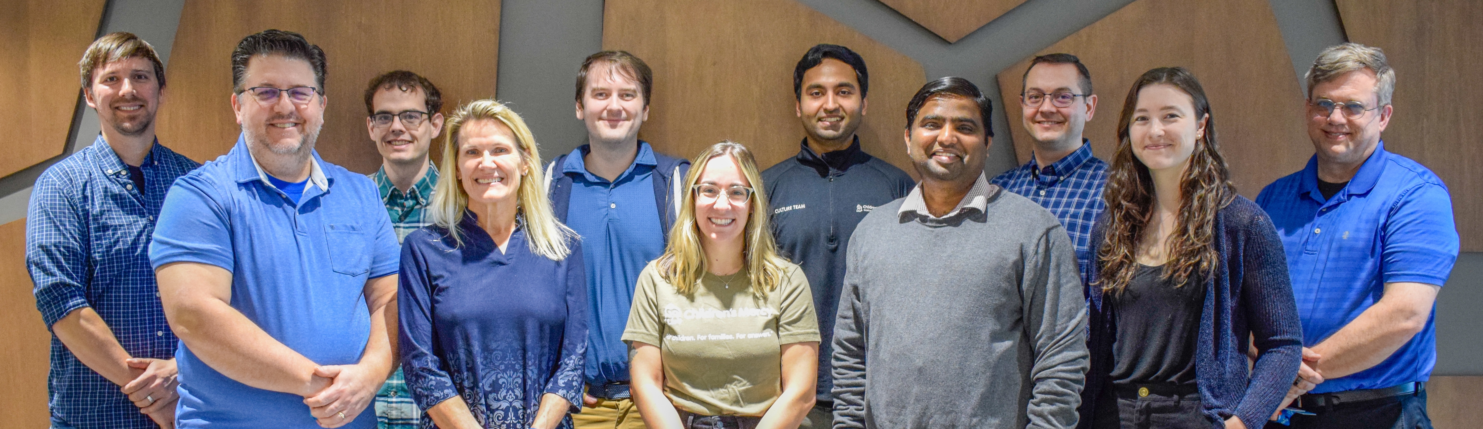The GeoMarker team pose. In the photo are 11 people with 3 being women and 8 being men.