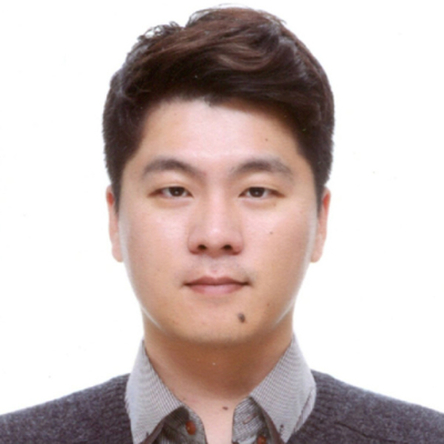 HyukJin Yun. He has dark hair. He's wearing a shirt with a collar and a sweater over it.