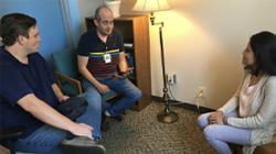 Three people having a language coaching conversation.
